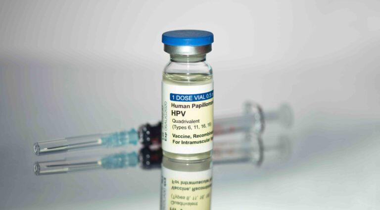 Human Papilloma Virus vaccine HPV with syringe on metal tray.