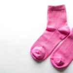 Pink socks on isolated white background